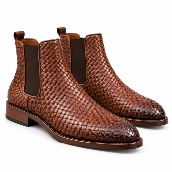 Three-quarter front view of one pair of cognac-brown genuine leather Chelsea-style ankle boots featuring an intricate basket-weave exterior, dark brown side panels, rear pull tabs, rounded almond-shaped toes, and low block heels on a white background.
