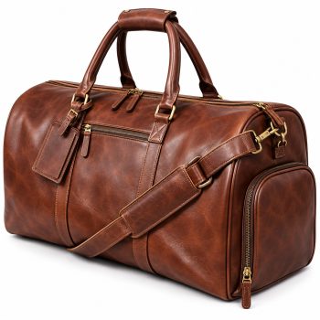 Angled view of Mizon International vintage brown genuine leather duffel travel bag featuring rounded carry handles, padded shoulder strap, front zipper pocket, zippered end compartment and antique gold-tone hardware.