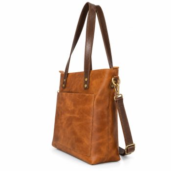 Front view of Mizon International women's genuine leather tote bag in cognac brown, featuring dark brown double shoulder handles, a large front patch pocket, long leather strap and antique gold-tone hardware.