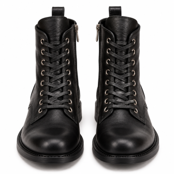 Pair of black genuine leather lace-up ankle boots shown from a three-quarter front angle, featuring silver-tone eyelets, black laces, a visible side zipper, rounded toes, low block heels, and rear pull tabs against a white background.